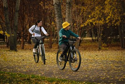 parent cycling child bike park